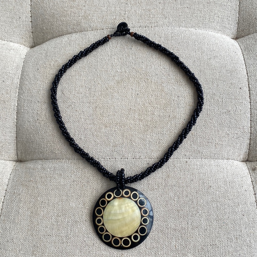 Black boho beaded necklace with large pendant.